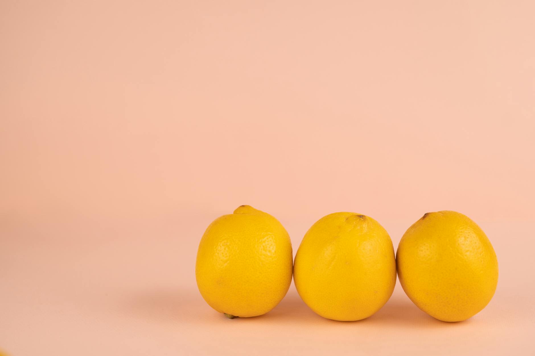 Bright ripe lemons arranged on a pastel background, symbolizing renewed energy and vitality